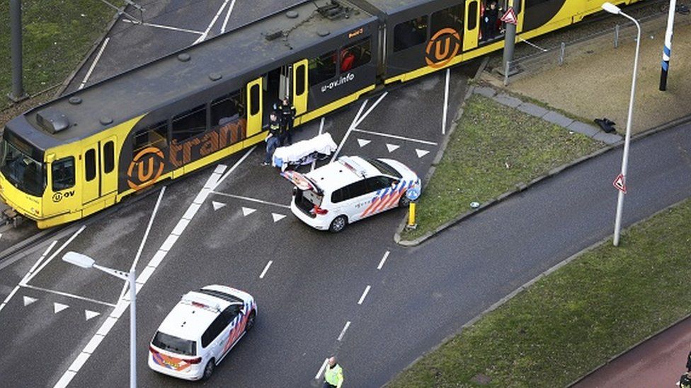 Police inspect a tram at the 24 Oktoberplace in Utrecht, where a shooting took place