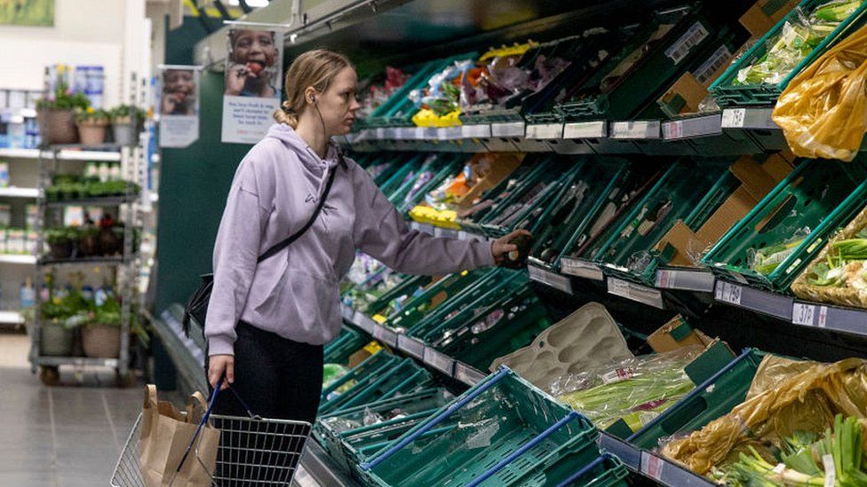 Woman shopper in UK supermarket, 26 March 2022