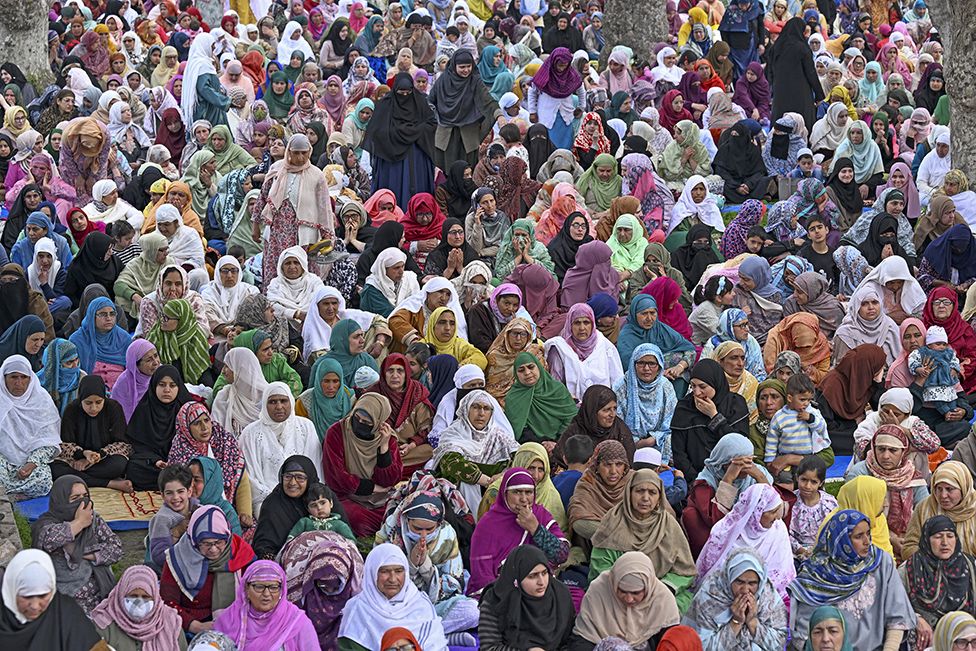Muslim devotees offer their last Friday prayers during the Islamic holy fasting month of Ramadan at the Hazratbal Shrine in Srinagar on April 5, 2024