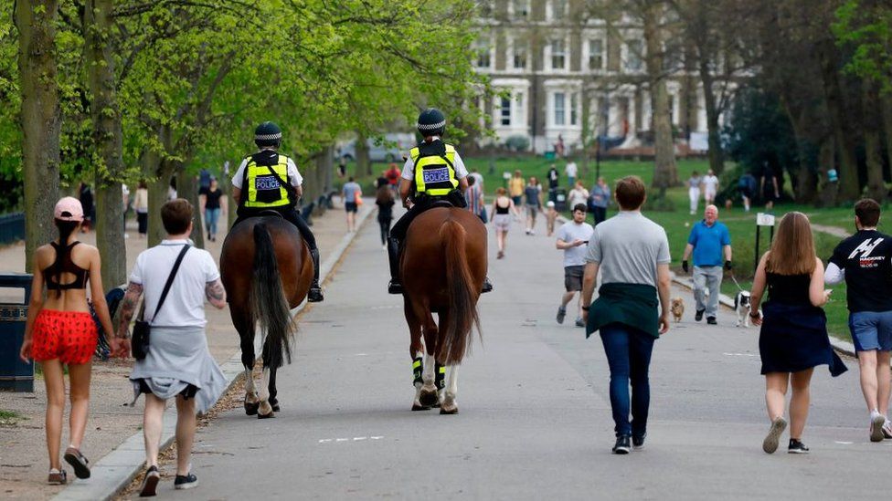 Police in Victoria Park in east London on 11 April 2020