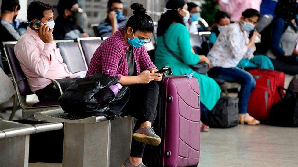 Passengers wait at Chennai airport