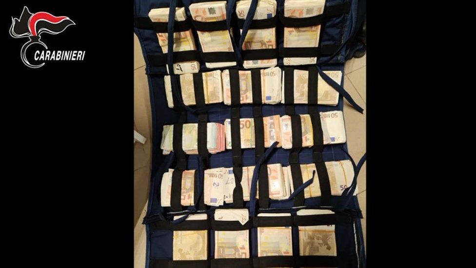 Photo shows stacks of euros packed into open bag