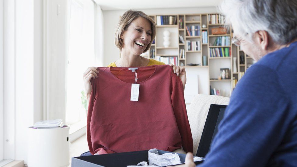 Woman holding a new top