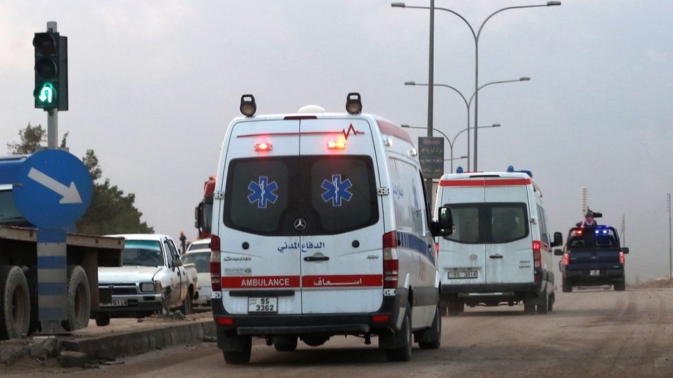 Ambulances leave the King Abdullah bin Al Hussein Training Centre in Muwaqqar on the outskirts of Amman, Jordan, on Monday.