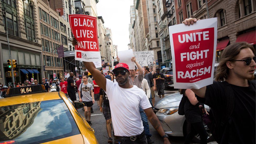 Protestors make their way north on Fifth Avenue as they march against white supremacy and racism, August 13, 2017 in New York City.