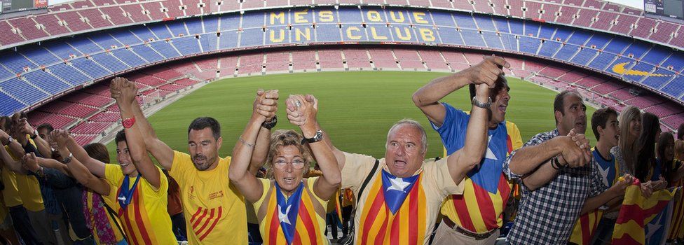 Catalans link arms in a bid to create a 400-kilometre (250-mile) human chain, part of a campaign for independence from Spain during Catalonia National Day, or Diada, at FC Barcelona's Camp Nou stadium in Barcelona, on 11 September 2013