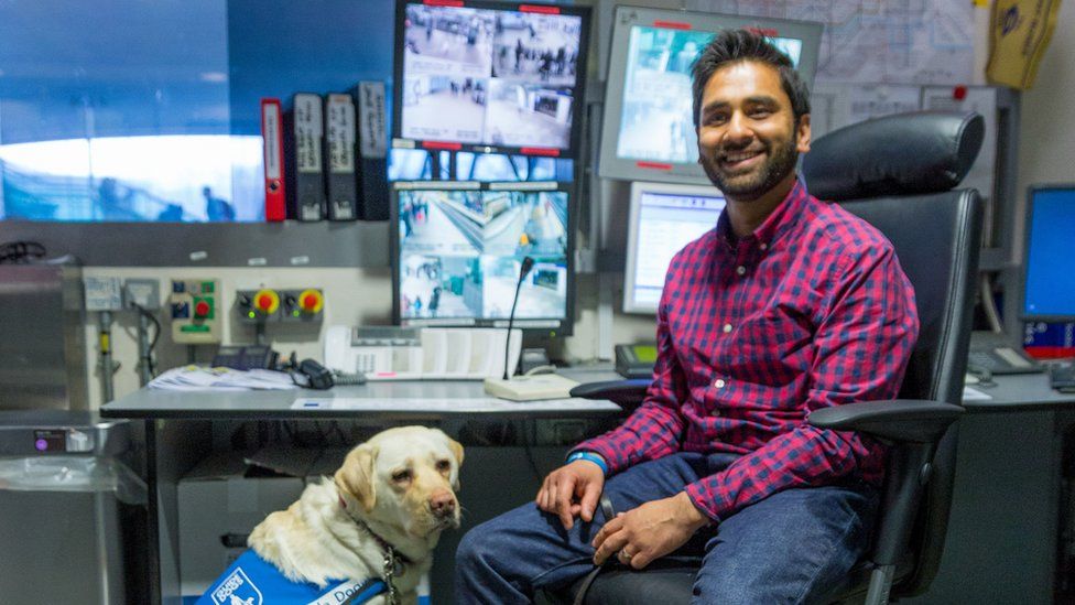 Dr Amit Patel with his guide dog Kika in a TfL recording studio