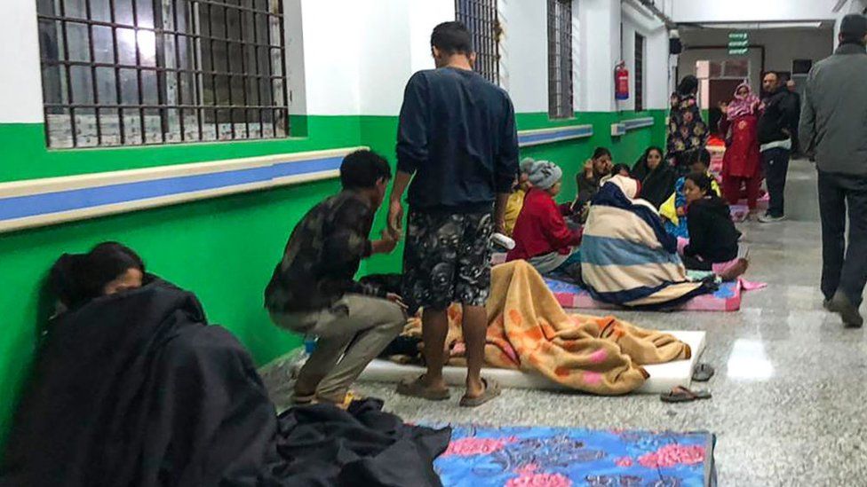 Survivors are seen at a corridor of the Jajarkot district hospital in the aftermath of an earthquake in Jajarkot