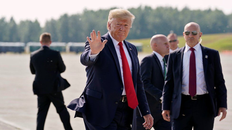 US President Donald Trump waves during a refuelling stop at Joint Base Elmendorf, Alaska, U.S. on his way to the G-20 Summit in Osaka, Japan, June 26, 2019