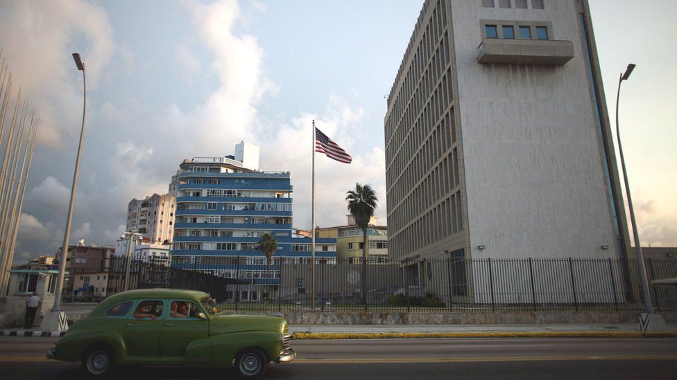 A vintage car passes by the U.S. Embassy in Havana, Cuba, September 21, 2016