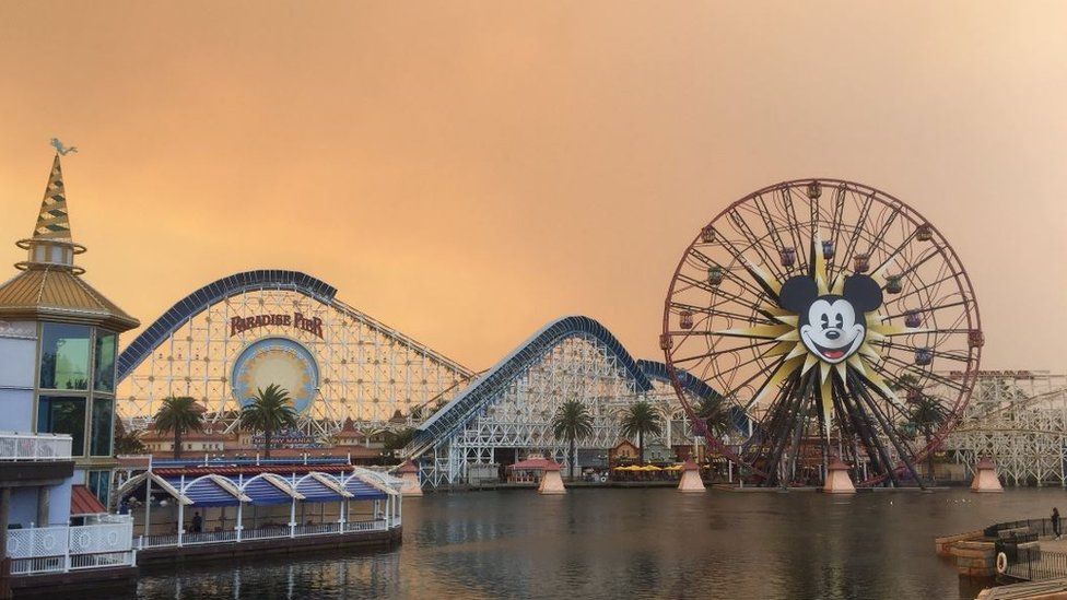 Disney theme park and orange sky