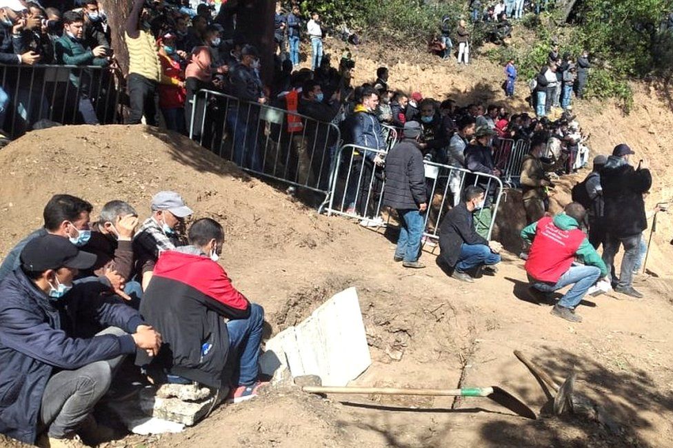 Mourners gather to pay their final respects to Rayan Oram, who died on Saturday after a days-long effort to rescue him from a well, during his funeral near Chefchaouen, Morocco, on 7 February 2022