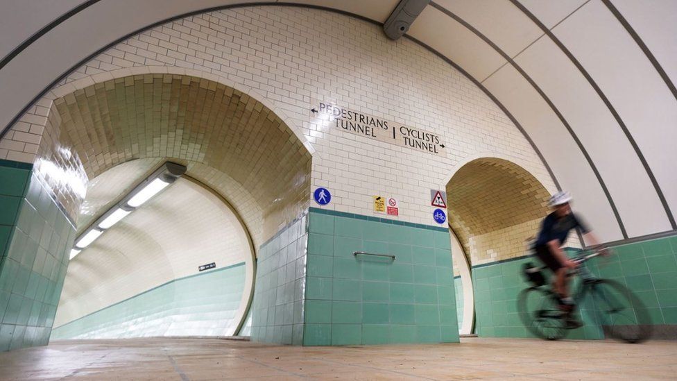 A cyclist in the reopened Tyne tunnel