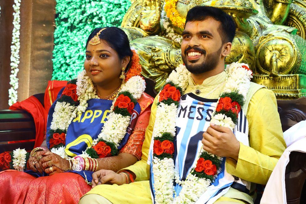 Sachin R and R Athira seen wearing football jerseys over their wedding finery