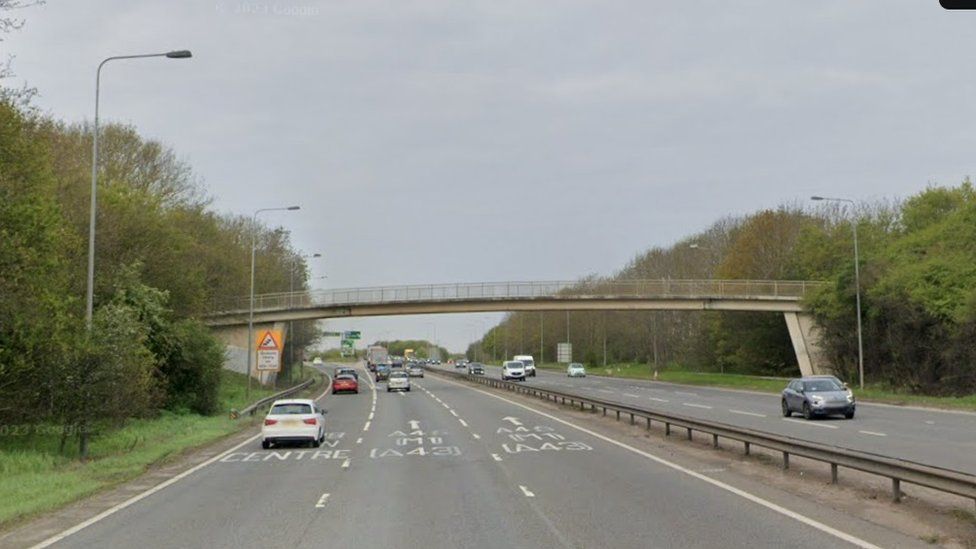 Footbridge over three-lane carriageway