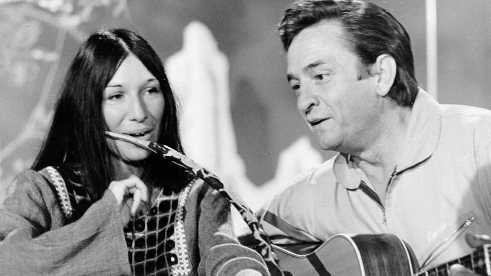 Singer/songwriter Buffy Sainte-Marie plays her mouth bow as she sings a duet with fellow singer/songwriter Johnny Cash on "The Johnny Cash Show" in 1969