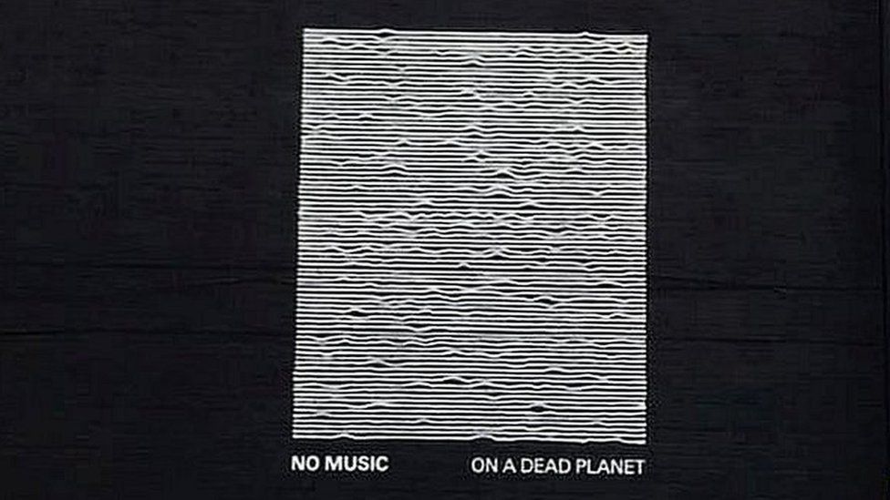 mural with flat lines and no music on a dead planet written below