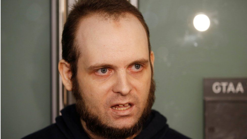 Joshua Boyle speaks to the media after arriving with his wife and three children at Toronto Pearson International Airport,