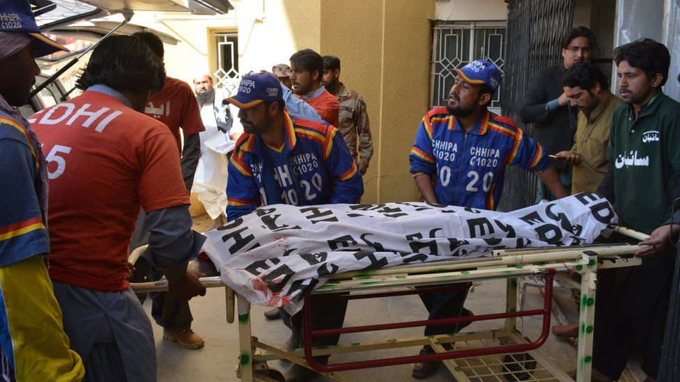 Pakistani volunteers transport the body of a polio worker from a hospital following an attack by gunmen in Quetta on January 18, 2018