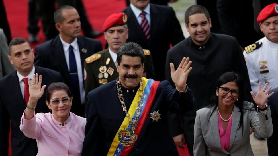 Venezuela's President Nicolas Maduro (C), his wife Cilia Flores (front L) and National Constituent Assembly President Delcy Rodriguez (front R), wave as they arrive for a session of the assembly at Palacio Federal Legislativo in Caracas, Venezuela August 10, 2017.