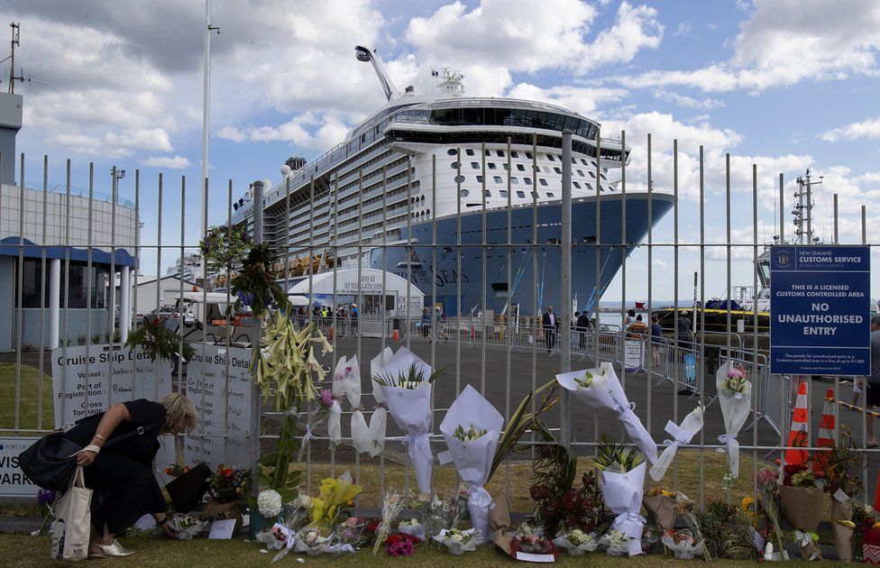 People leave tributes at the Port of Tauranga