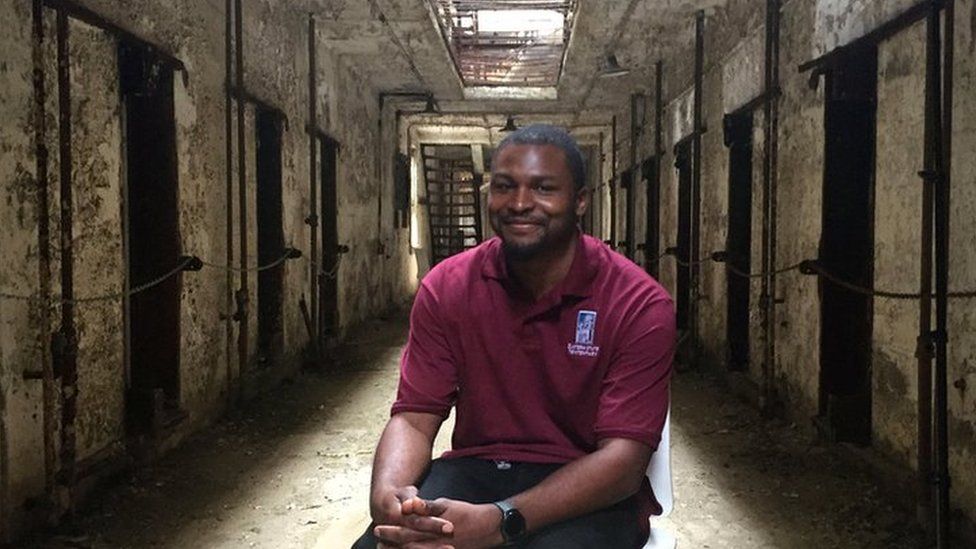 Tour guide Russell Craig in a cell block at Eastern State Penitentiary