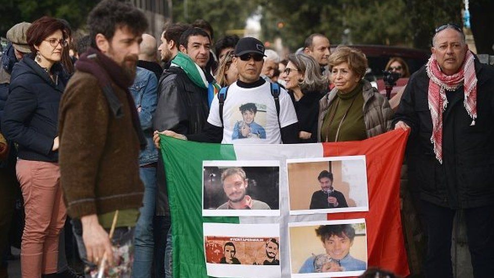 People hold a vigil for Giulio Regeni in front of the Italian Embassy in Cairo (file photo)