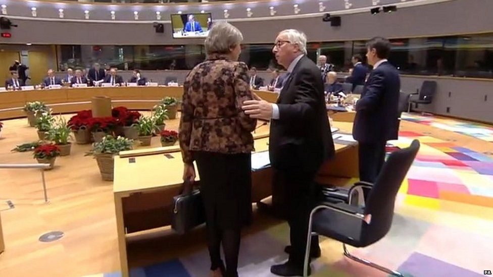 Theresa May speaking to Jean-Claude Juncker