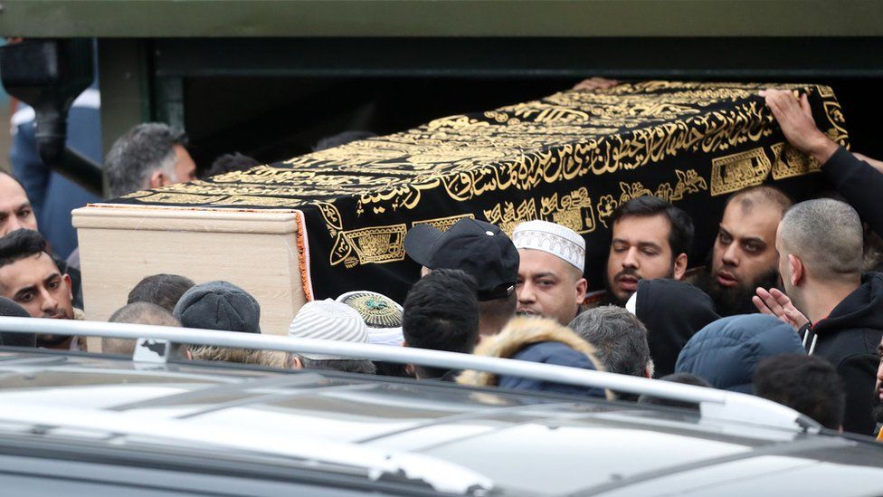 The coffin of Yassar Yaqub is carried outside Masjid Bilal Huddersfield