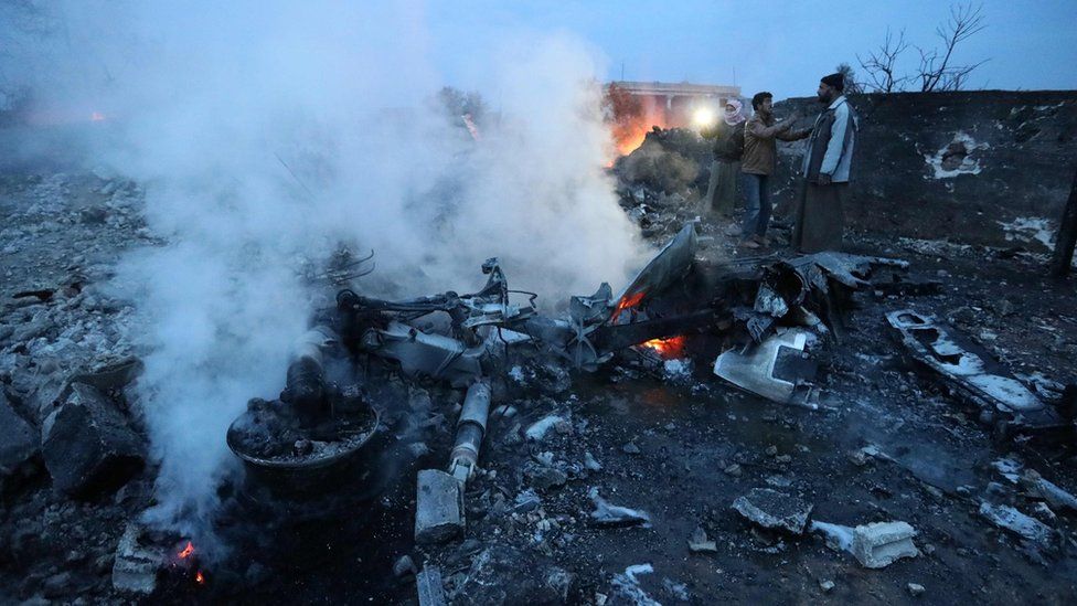smoking wreckage of a downed Sukhoi-25 jet in Saraqeb