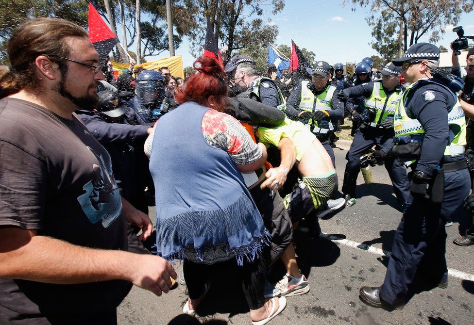 A fight breaks out during anti-Islam protests in Melbourne on Sunday