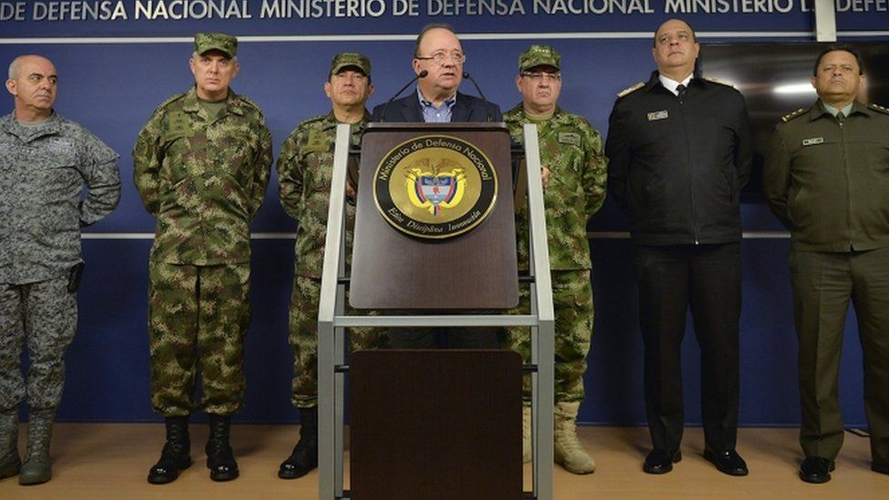 This handout picture released by the Colombian Defence Ministry's press office shows Colombia's Defense Minister Luis Carlos Villegas (C) and the Police and Armed Forces commanders on 1 April