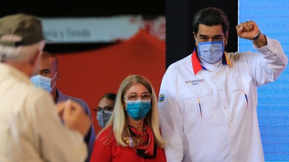 A handout photo released by Miraflores Presidential Palace shows Venezuelan President Nicolas Maduro (R) accompanied by First Lady Cilia Flores arriving to a government act in Caracas, Venezuela, 20 November 2020