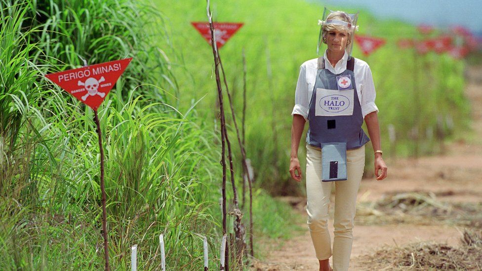 Princess Diana walking through a landmine field in Angola in 1997