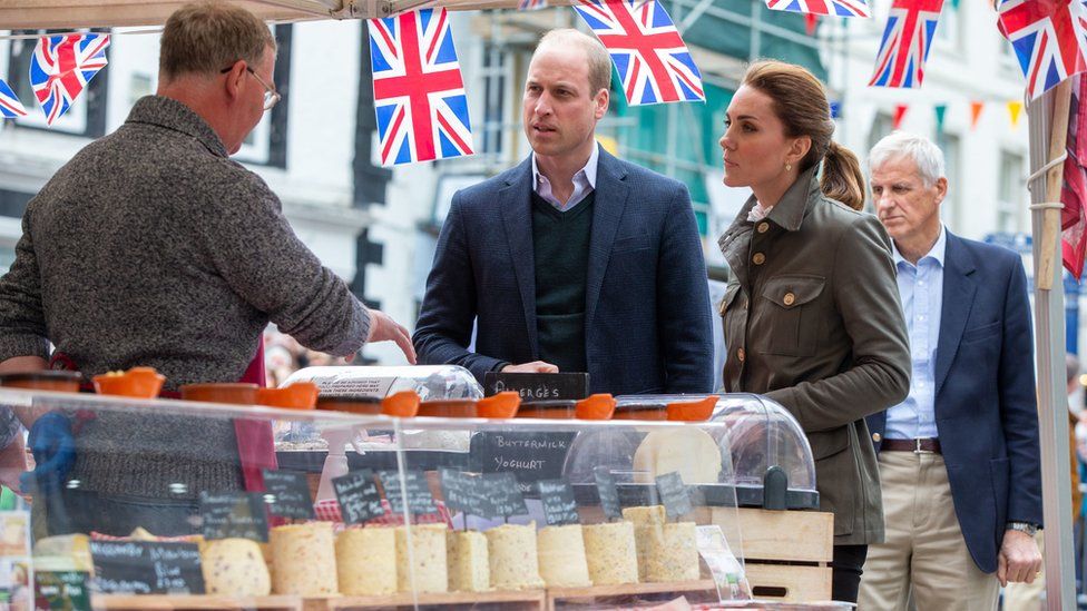 Royal couple sampling local cheese