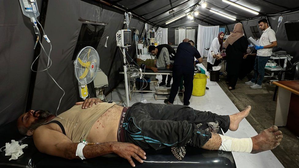 Patients are treated at a field hospital in Rafah, in the southern Gaza Strip (8 May 2024)