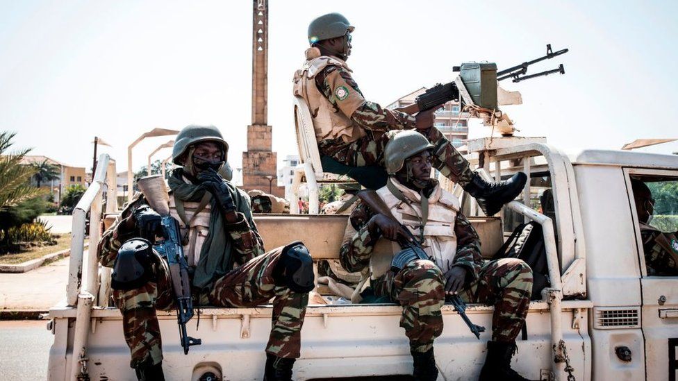 Soldiers from the Economic Community of West Africa States's (ECOWAS) security mission in Guinea-Bissau (ECOMIB) wait in their truck outside the presidential palace in Bissau on November 24, 2019