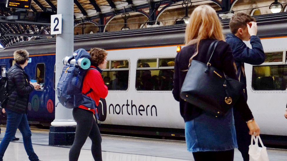 Passengers and a Northern train at Newcastle upon Tyne railway station