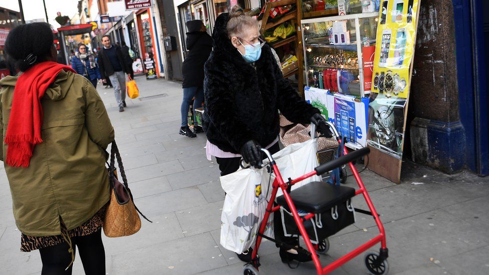 An elderly woman wears a face mask while out shopping London, Britain, 11 March 2020. The number of UK Coronavirus COVID-19 cases continues to rise
