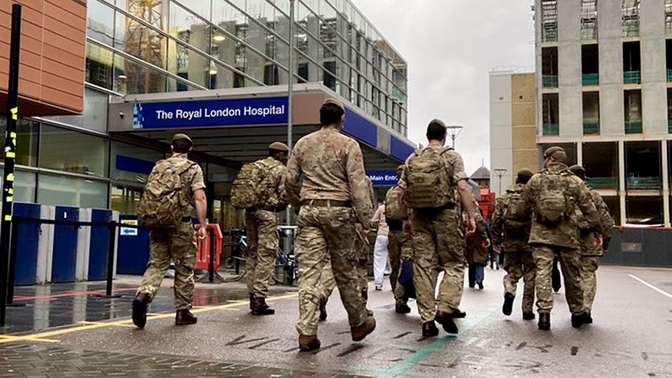 Armed Forces personnel enter the Royal London Hospital