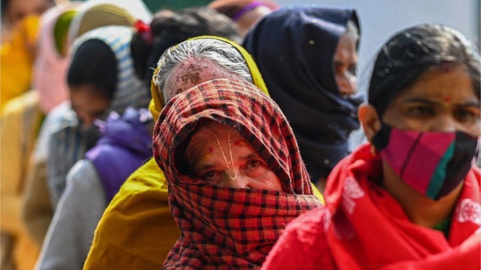 Women voters queue up in Ghaziabad in Uttar Pradesh on the first day of voting on 10 Feb 2022