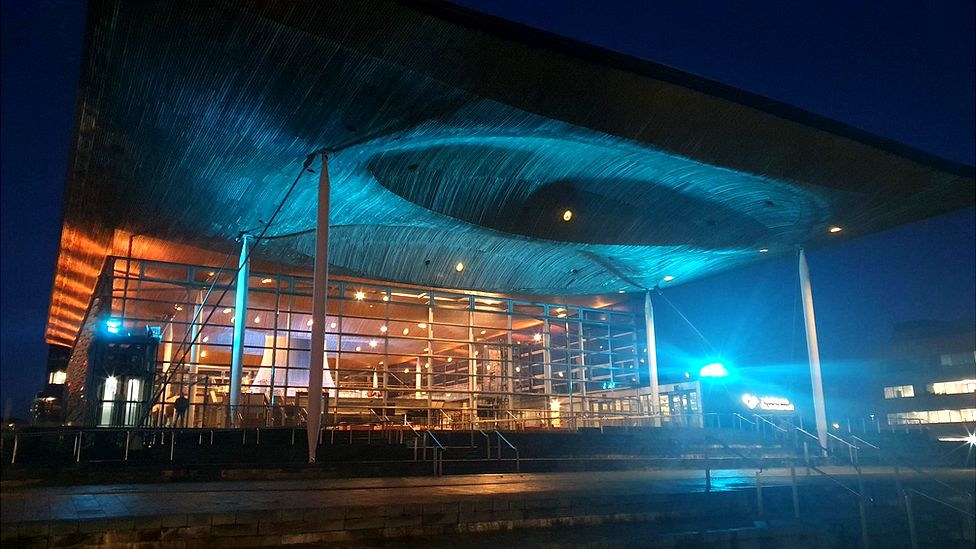 The Senedd lit up in the Ukrainian colours yellow and blue