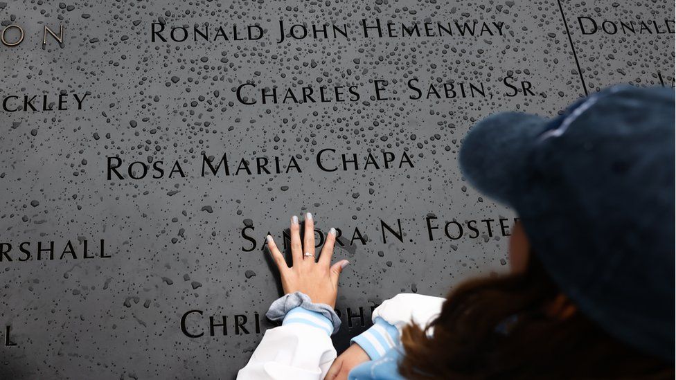 Hand touching memorial