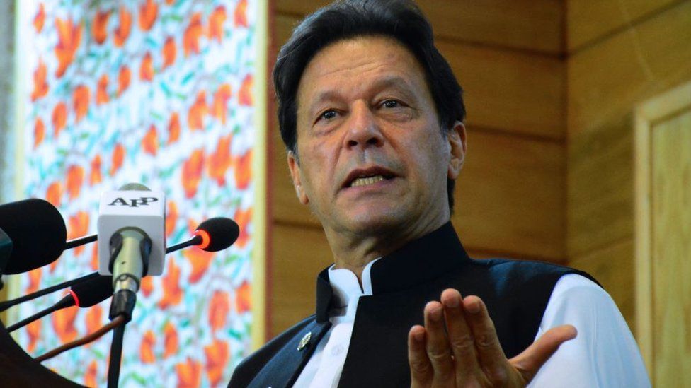 Pakistan's Prime Minister Imran Khan addresses the legislative assembly in Muzaffarabad, the capital of Pakistan-controlled Kashmir on August 5, 2020, to mark the one-year anniversary after New Delhi imposed direct rule on Indian-administered Kashmir.