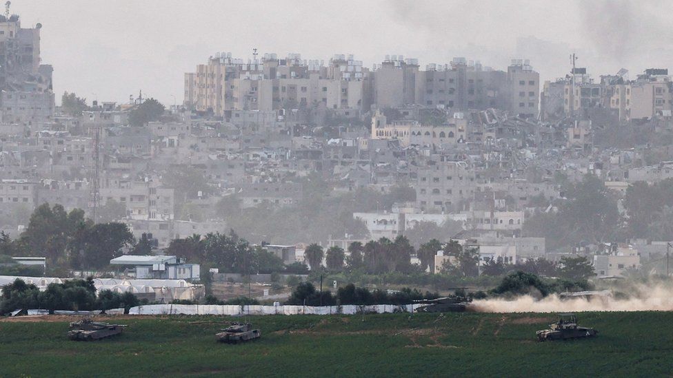 Israeli tanks manoeuvre inside the Gaza Strip, as seen from southern Israel (29 October 2023)