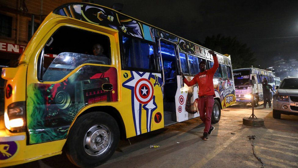A Kenyan calls for passengers at a bus station to board public transport in Nairobi, Kenya, 19 September 2023.