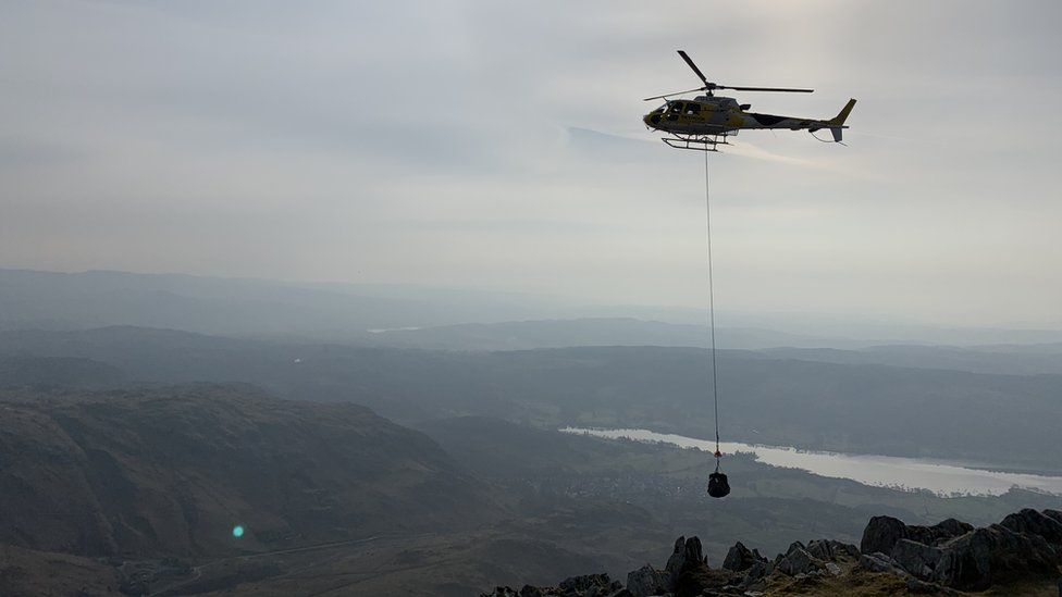 Helicopter lifting stones to Coniston Old Man