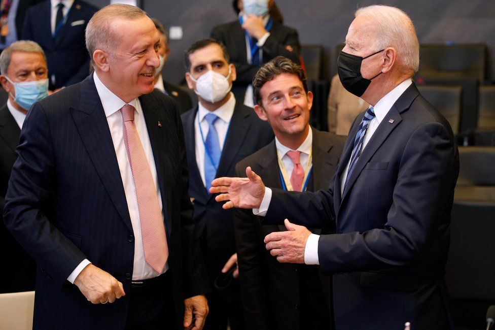 US President Joe Biden (R) speaks with Turkey's President Recep Tayyip Erdogan (L) during a plenary session at a NATO summit in Brussels, Belgium, 14 June 2021