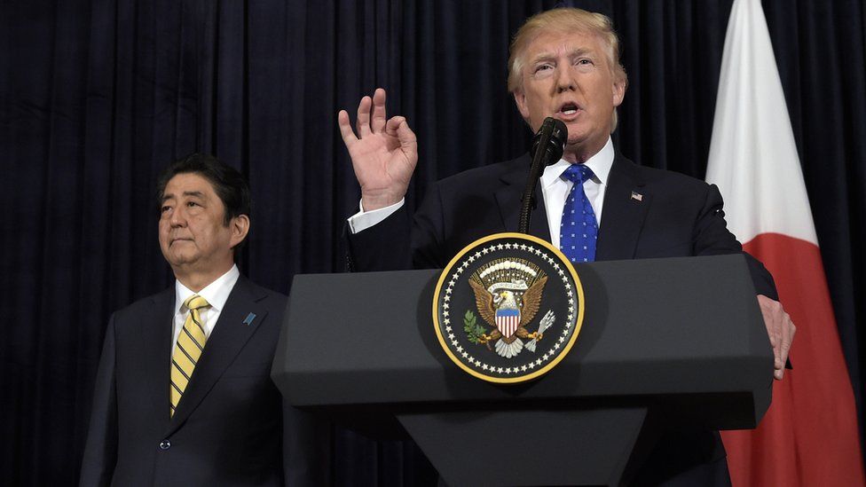 US President Donald Trump speaks alongside Japanese Prime Minister Shinzo Abe following North Korea's missile launch on Sunday, 11 February 2017