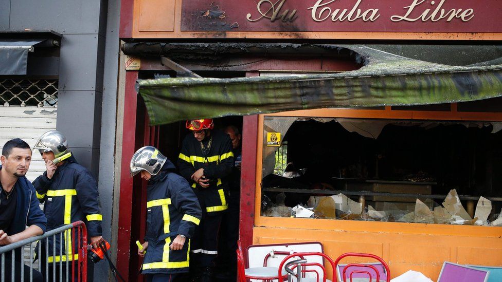 Firefighters leave after inspecting the damaged Au Cuba Libre bar in Rouen, northern France (6 August 2016)